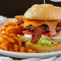 Bacon & Cheddar Melburger · Draped with cheddar cheese, two strips of bacon, lettuce, tomato, and onion, with Thousand i...