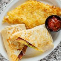 Breakfast Burrito · Tortilla filled with two eggs scrambled with cheese, country sausage, Mels potatoes, and a t...