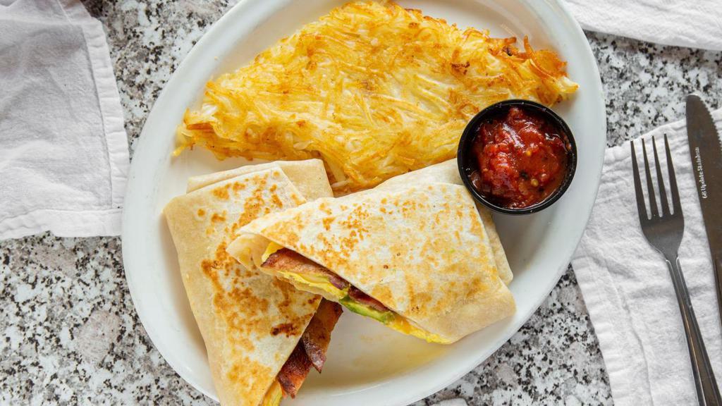 Breakfast Burrito · Tortilla filled with two eggs scrambled with cheese, country sausage, Mels potatoes, and a touch of country gravy. Comes with a side of sour cream and salsa.
