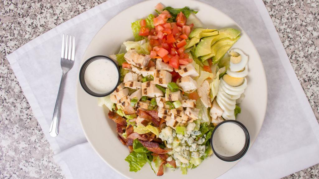 Mels Cobb Salad · Lettuce, chopped bacon, diced chicken, avocado, green onions, egg, tomato, and bleu cheese crumbles.
