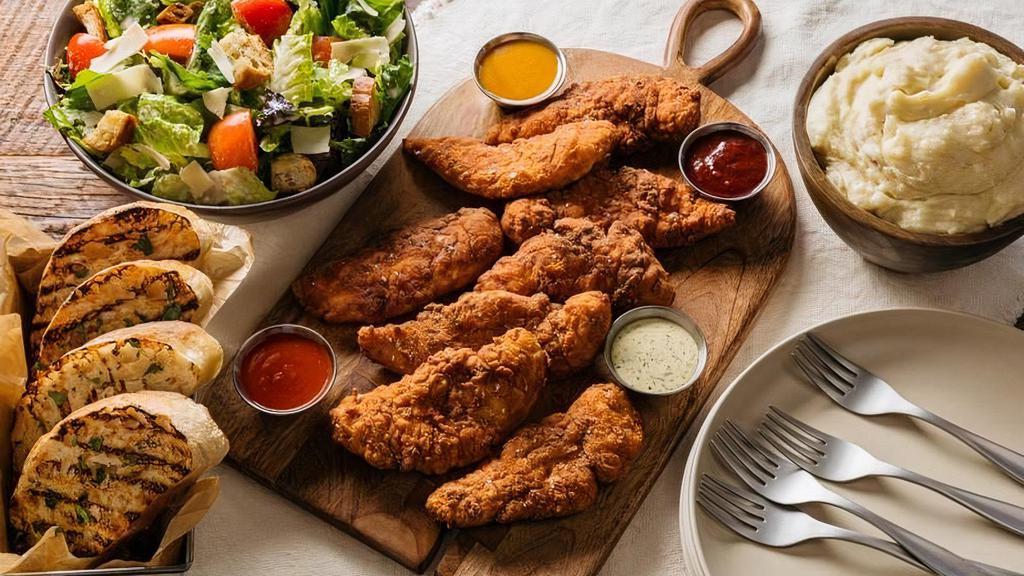 Chicken Tender Family Meal · classic crispy or nashville hot. twelve crispy jumbo, hand tossed buttermilk-battered, antibiotic & hormone free, never frozen chicken tenders, choice of two family sides, four housemade dipping sauces and grilled artisan bread