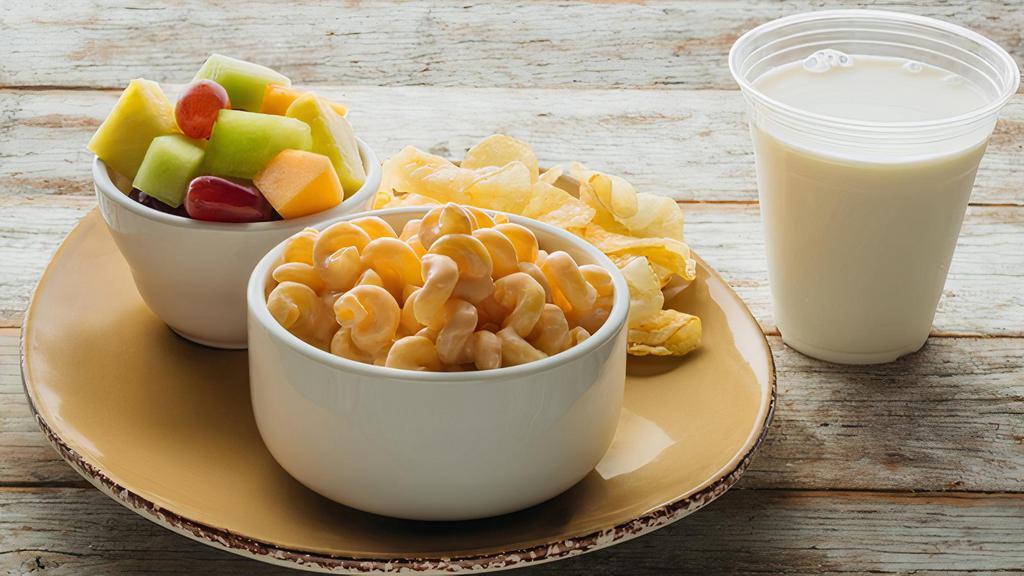 Kids Macaroni & Cheese · Creamy cheddar cheese sauce & pasta. Served with fruit salad & chips..