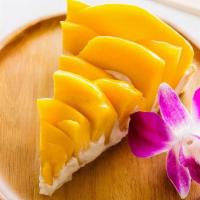 Mango Tart · hand sliced mangoes layered with rum cream in a handmade butter tart shell