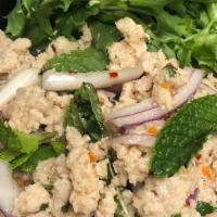 Larb · Ground meat salad lime dressing with onions, cilantro mint, kaffir lime leave, roasted rice ...