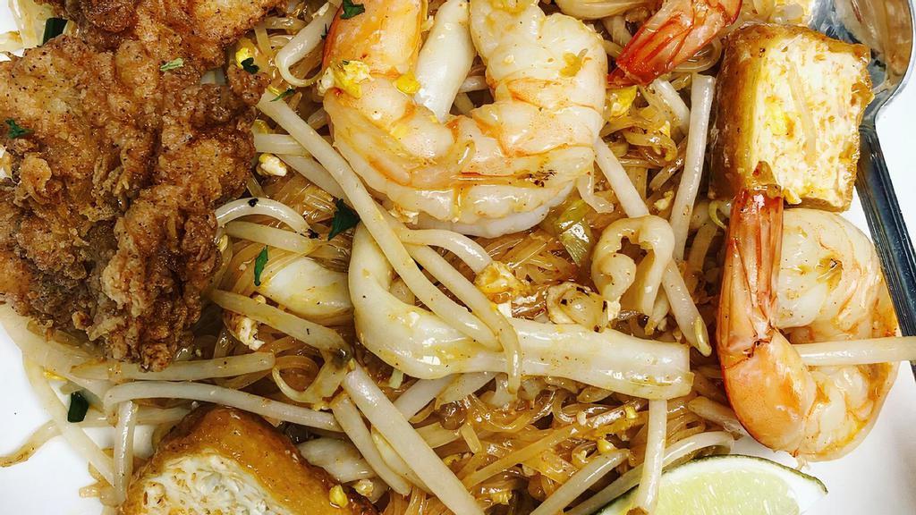 Pad Thai · Most Popular. Classic Thai famous stir-fried rice noodle in sweet - sour tamarind sauce with bean sprouts, tofu, green onion and peanut.