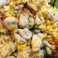 Crab fried rice · Thai Fried rice with jumbo crab meat eggs and onions.
