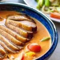 Duck curry · Red curry paste cooked with coconut milk DUCK BREAST, pineapple tomato basil and bell pepper.