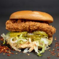 $ide Chick · Spicy cluck sauce, fried chick'n, lettuce, pickles on a vegan brioche bun.
