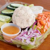 Tuna Salad · Housemade Tuna Salad with Choice of Toppings and Dressing over Romaine lettuce.