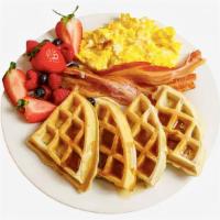 Waffle Combo · Two scrambled eggs, one large Belgian waffle, and your choice of meat. Served with syrup on ...