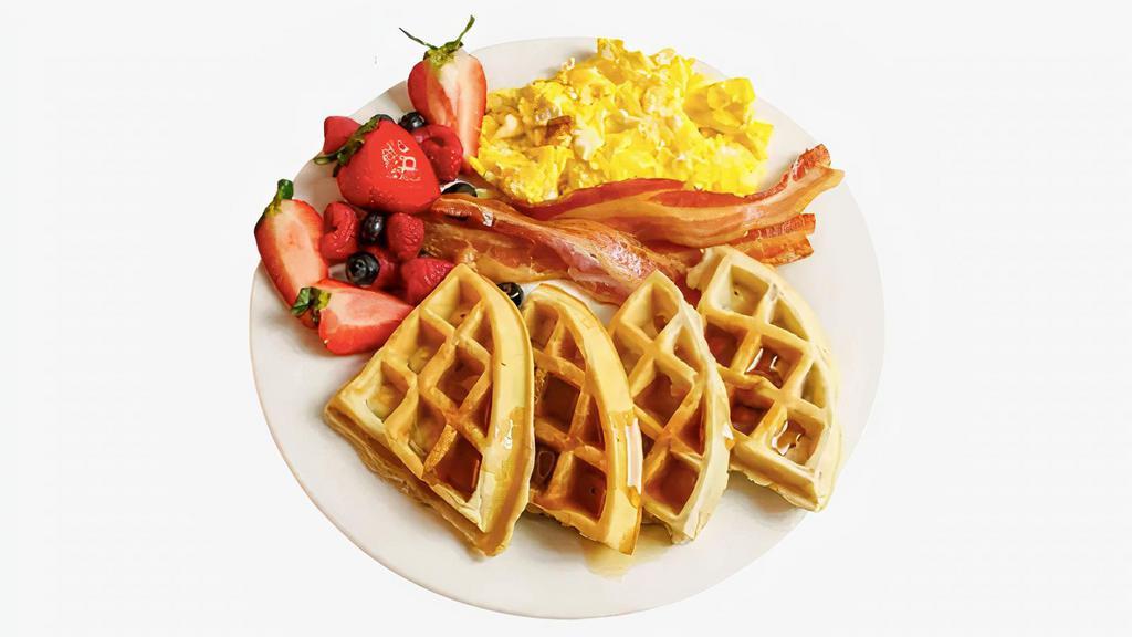 Waffle Combo · Two scrambled eggs, one large Belgian waffle, and your choice of meat. Served with syrup on the side.