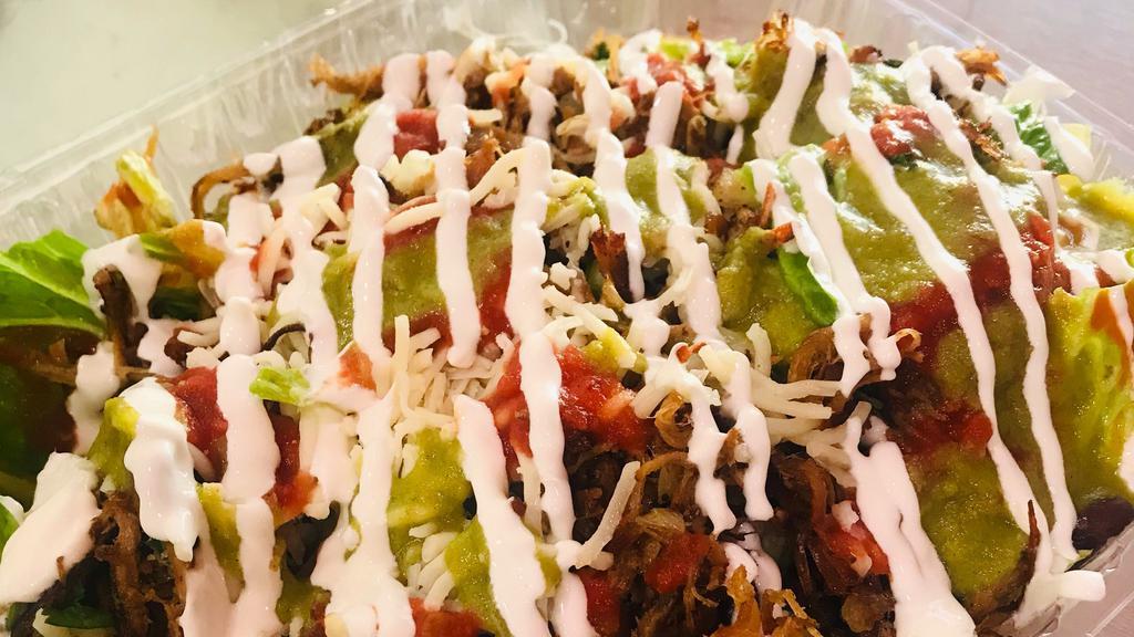 Salad Bowl · Meat, lettuce, black beans, onions, cilantro, sour cream, cheese, and salsa.