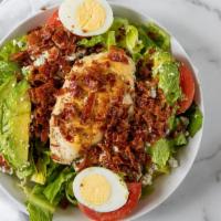 California Cobb Salad · Most popular. Grilled chicken, bleu cheese, avocado, bacon, egg, tomato, and onion.