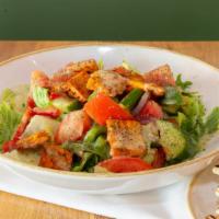 Fattoush Salad · Vegetarian. Romaine hearts, cucumber, tomato, onion, bell peppers, sumac, dried mint and  pi...