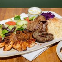 House Combo Plate · Koftedes, chicken kebab, beef kebab, lamb & beef gyros. Served with rice, salad and pita bre...