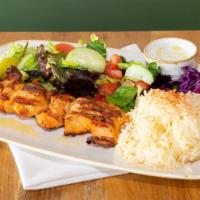 Chicken Kebab · Herb marinated chicken breast cubes. Served with rice, salad and pita bread.