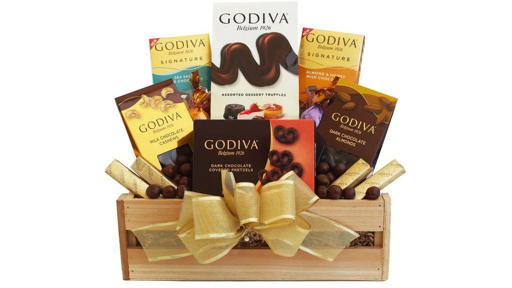 Godiva Sampler Gift Crate · Simple, Elegant, Godiva.  Sample the delicious tastes of Godiva chocolates including an assortment of  chocolate truffles, a rich Godiva  chocolate bar, chocolate-covered pretzels, and chocolate dipped nuts all presented inside a gift crate and topped with a gold bow.Godiva Assorted Truffles (4.2 oz each, 1 count); Godiva Chocolate Bar (3.1 oz each, 2 count); Godiva Chocolate Cashews (2 oz each, 1 count); Godiva Chocolate Almonds (2 oz each, 1 count); Godiva Chocolate Pretzels (2.5 oz each, 1 count)