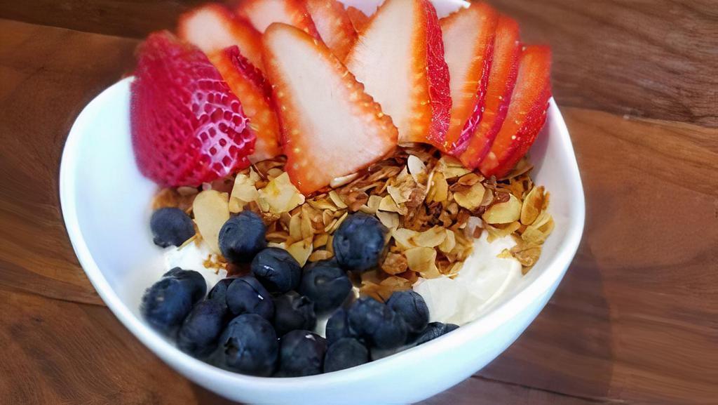 Granola-Yogurt-Fruit-Parfait · Plain Greek yogurt infused with honey and vanilla bean, topped with housemate granola, and fresh berries.  *contains nuts and seeds<br />