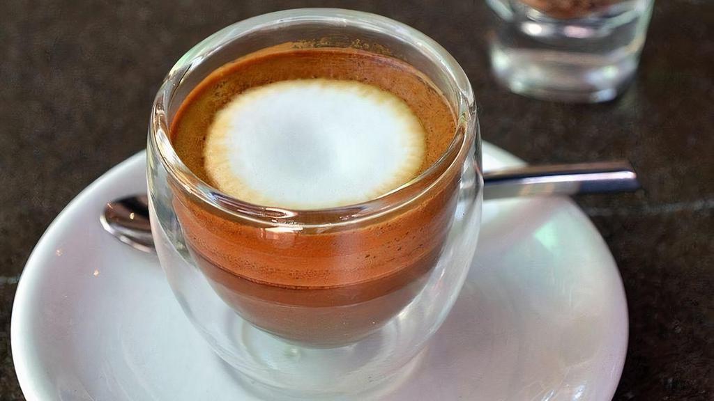 Macchiato · 2 shots of espresso with small layer of foam