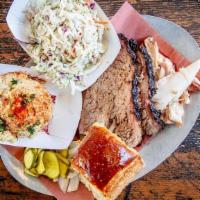 #2 Choose Two Meats · Best seller! Comes with your choice of smoked meat, choice of two sides or fixin's, pickles,...