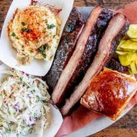 #5 Smoked Rib Plate · Three quarters of a pound of ribs with your choice of two sides or fixin's, pickles, and a w...
