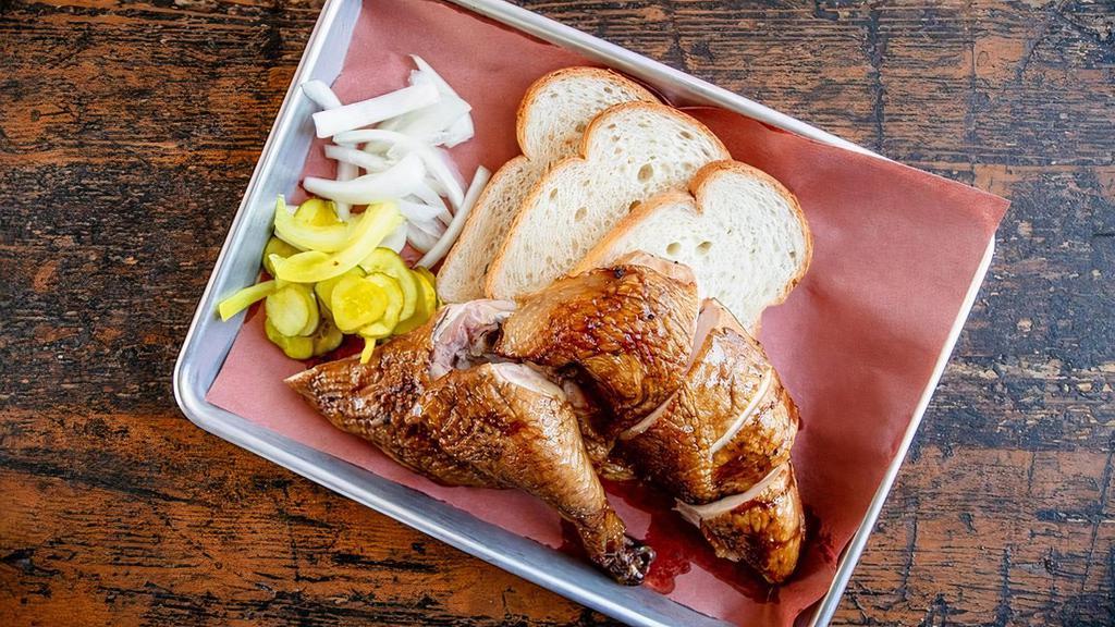 Bone In Smoked Chicken · Comes with pickles, sliced sweet Vidalia onion, and white bread.
