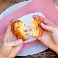 Frankaroni · House specialty! Crispy fried mac & cheese with hot dog inside.