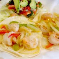 Taco de Camarón · 1 taco: Shrimp cooked in butter with seasonings, onions, and peppers