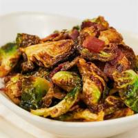 Crispy Brussels Sprouts · Roasted brussels sprouts and crispy leaves tossed with bacon and Vermont maple butter glaze.