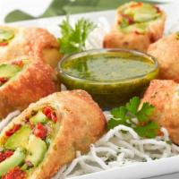 Avocado Eggrolls · Avocado, Sun-Dried Tomato, Red Onion and Cilantro Fried in a Crisp Wrapper. Served with a Ta...