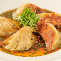 Chicken Pot Stickers · Asian Dumplings Pan-Fried in the Classic Tradition. Served with Our Soy-Ginger Sesame Sauce
