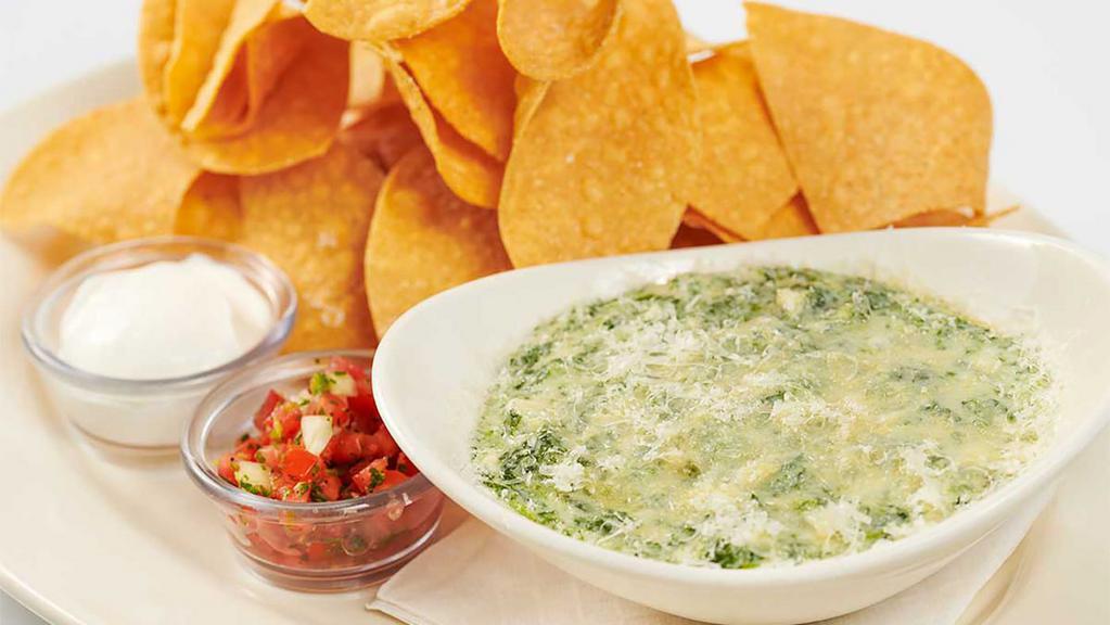 Hot Spinach And Cheese Dip · Spinach, Artichoke Hearts, Shallots, Garlic and a Mixture of Cheeses Served Bubbly Hot with Tortilla Chips and Salsa. Enough for Two