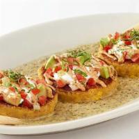 Sweet Corn Tamale Cakes · Topped with Sour Cream, Salsa, Cilantro, Avocado and Salsa Verde