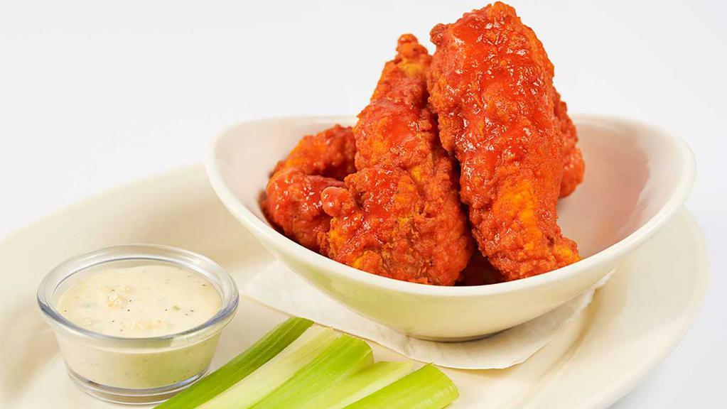 Buffalo Chicken Strips · Fried Chicken Strips Covered in Hot Sauce and Served with Blue Cheese Dressing and Celery Sticks