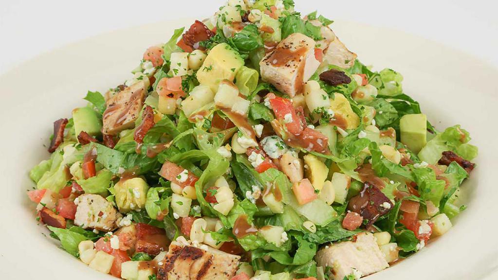 Factory Chopped Salad · A Delicious Blend of Julienne Romaine, Grilled Chicken, Tomato, Avocado, Corn, Bacon, Blue Cheese and Apple with Our Vinaigrette