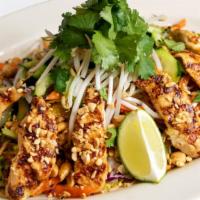 Thai Chicken Salad · Satay Chicken Strips, Lettuce, Carrots, Rice Noodles, Cucumbers, Bean Sprouts, Cilantro, Pea...