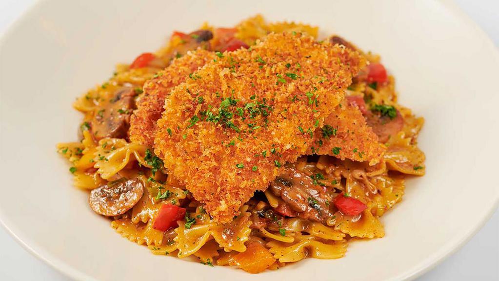 Lunch Louisiana Chicken Pasta · Parmesan Crusted Chicken Served Over Pasta with Mushrooms, Peppers and Onions in a Spicy New Orleans Sauce
