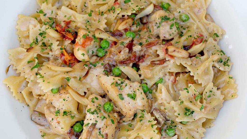 Lunch Farfalle With Chicken And Roasted Garlic · Bow-Tie Pasta, Chicken, Mushrooms, Tomato, Pancetta, Peas and Caramelized Onions in a Roasted Garlic-Parmesan Cream Sauce
