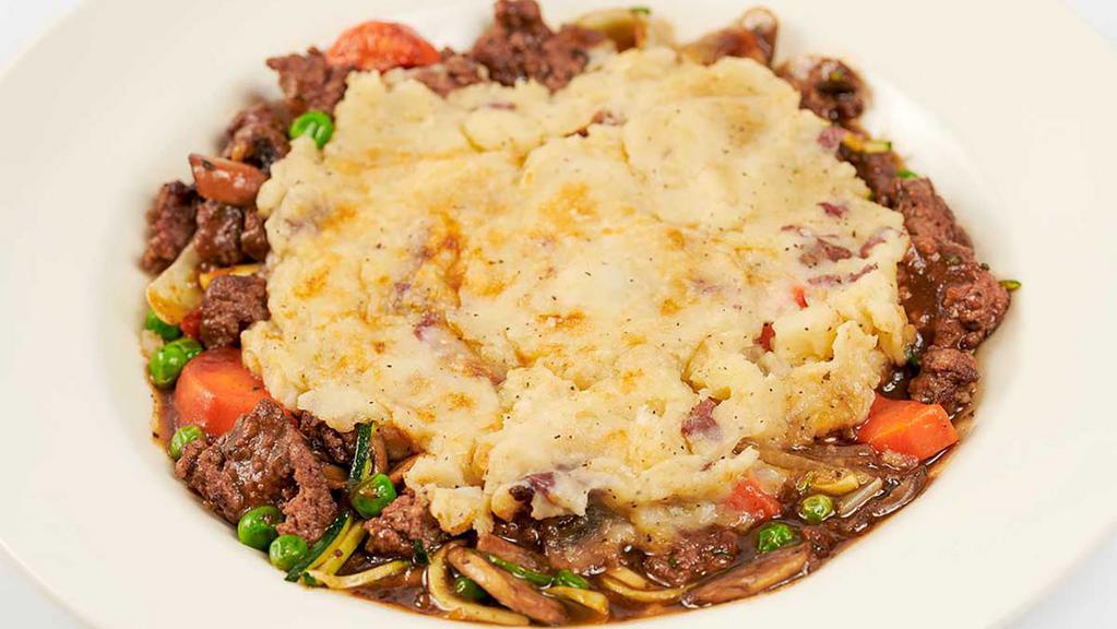 Lunch Shepherd's Pie · Ground Beef, Carrots, Peas, Zucchini and Onions in a Delicious Mushroom Gravy Covered with a Mashed Potato-Parmesan Cheese Crust