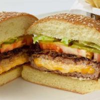 Stuffed Cheddar Burger · Our Charbroiled Burger Stuffed with Cheddar and American Cheese with Grilled Onions and Spec...