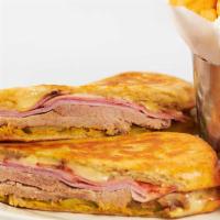 Cuban Sandwich · Slow Roasted Pork, Ham, Swiss Cheese, Pickles, Mustard and Mayonnaise on a Grilled and Press...
