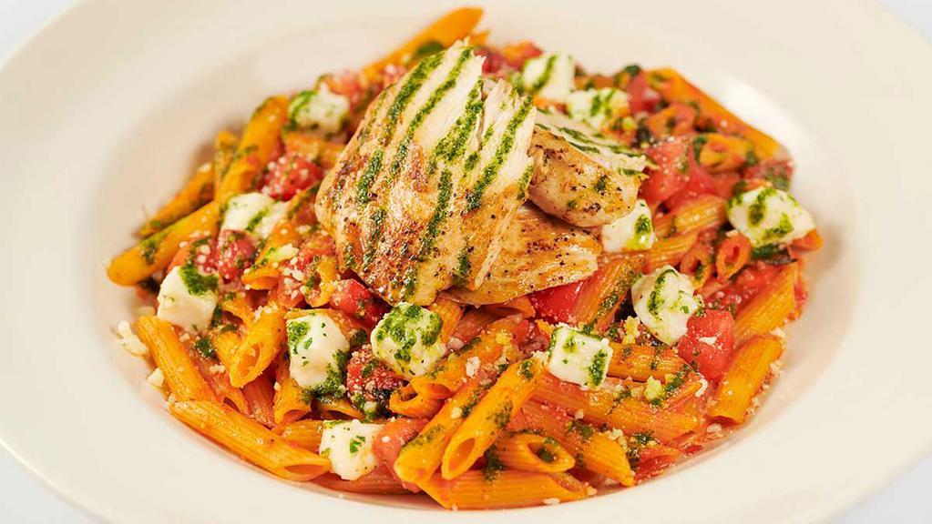 Tomato Basil Pasta · Grilled Chicken, Fresh Mozzarella, a Touch of Garlic and Penne Pasta. Light and Fresh (Full-size portion only)