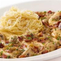 Chicken Riesling · Chicken Breast, Mushrooms, Bacon, Onions and Garlic in a White Wine Riesling Cream Sauce Ser...