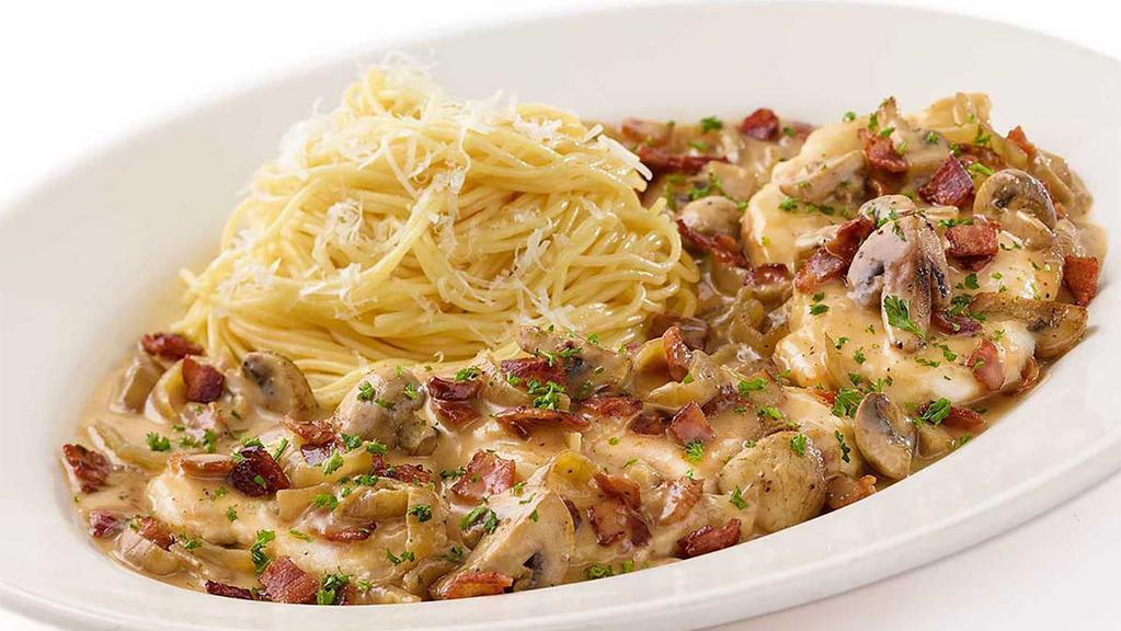 Chicken Riesling · Chicken Breast, Mushrooms, Bacon, Onions and Garlic in a White Wine Riesling Cream Sauce Served with Buttered Parmesan Pasta
