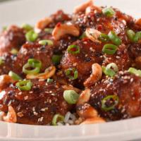 Spicy Cashew Chicken · A Very Spicy Mandarin-Style Dish with Green Onions and Roasted Cashews. Served over Rice