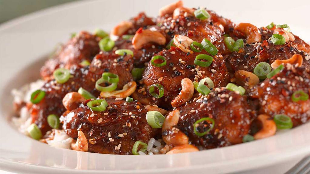 Spicy Cashew Chicken · A Very Spicy Mandarin-Style Dish with Green Onions and Roasted Cashews. Served over Rice