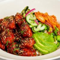 Korean Fried Chicken · Crispy Chicken Tossed with Our Spicy Korean B.B.Q. Sauce and Served Over Steamed Rice with A...