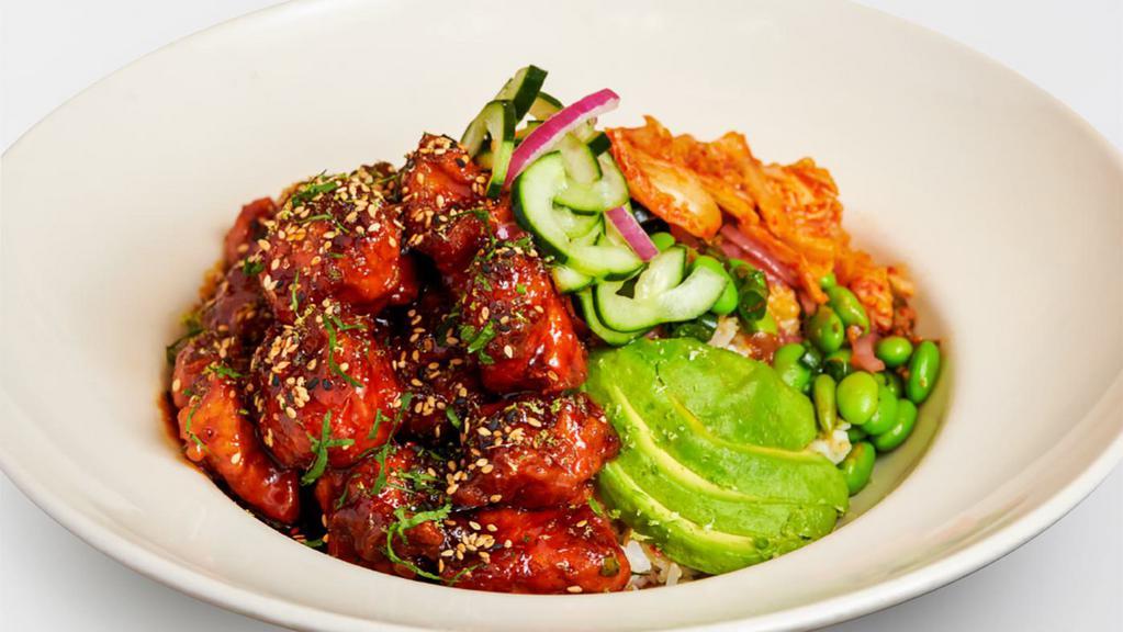 Korean Fried Chicken · Crispy Chicken Tossed with Our Spicy Korean B.B.Q. Sauce and Served Over Steamed Rice with Avocado, Kimchi, Mushrooms, Edamame, Cilantro and Sesame Seeds