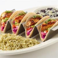 Crispy Beer Battered Fish Tacos · Soft Corn Tortillas Filled with Avocado, Tomato, Chipotle Sauce, Marinated Onions and Cilant...