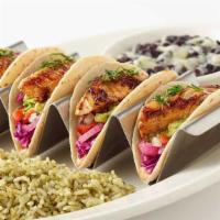 Grilled Fish Tacos · Soft Corn Tortillas Filled with Avocado, Tomato, Chipotle Sauce, Marinated Onions and Cilant...